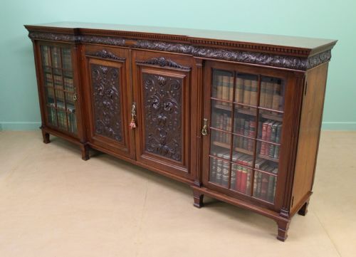 fig 4. Long Victorian Carved Walnut Bookcase by Maple and Co. 