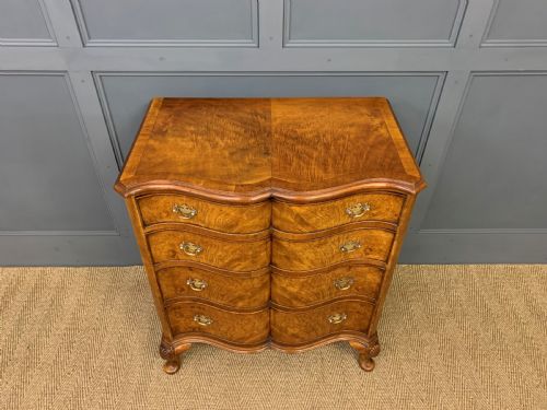 fig 5. Waring and Gillow Burr Walnut Serpentine Chest of Drawers