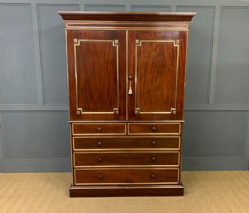 Early 19th Century Brass Mounted Flame Mahogany Linen Press