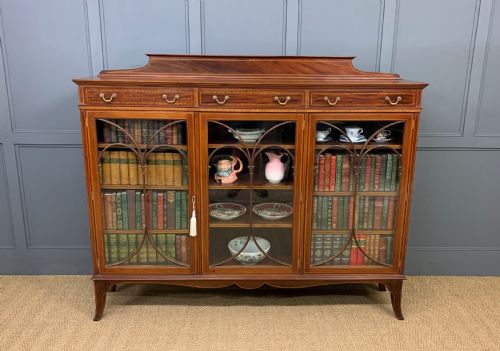 fig 1. Inlaid Mahogany Bookcase by Maple & Co.