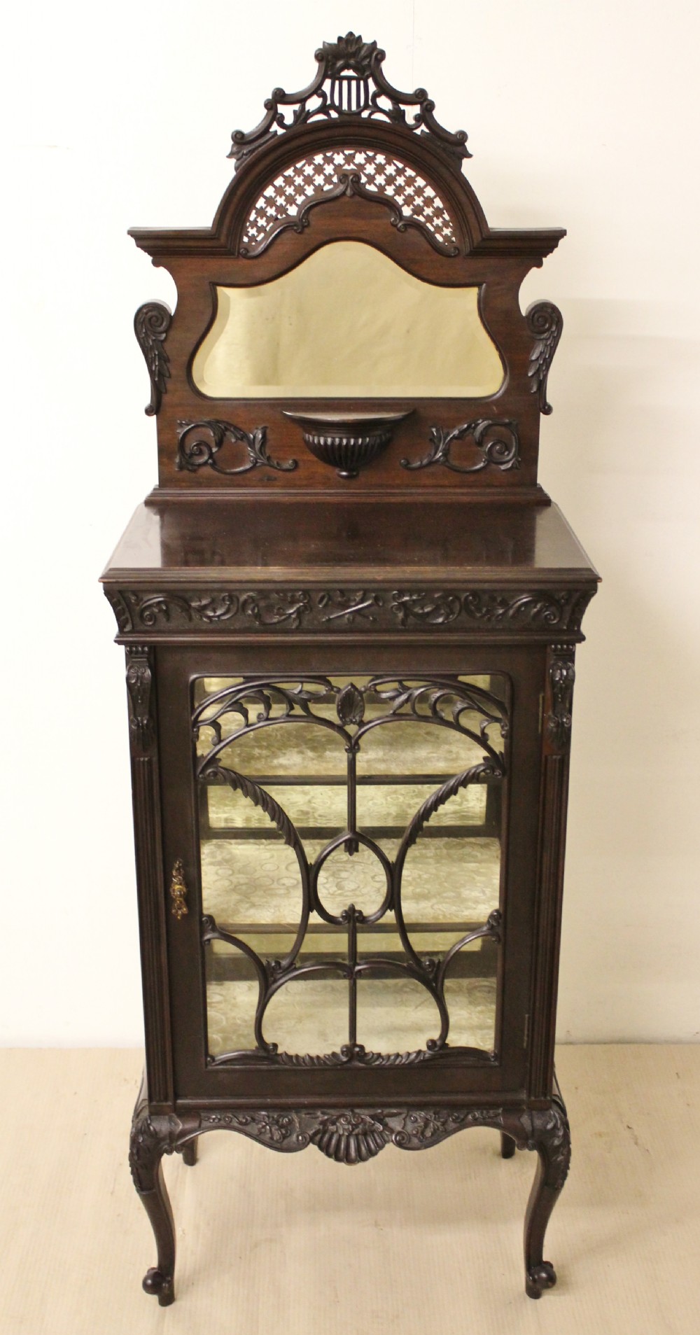 Carved Mahogany Music Cabinet