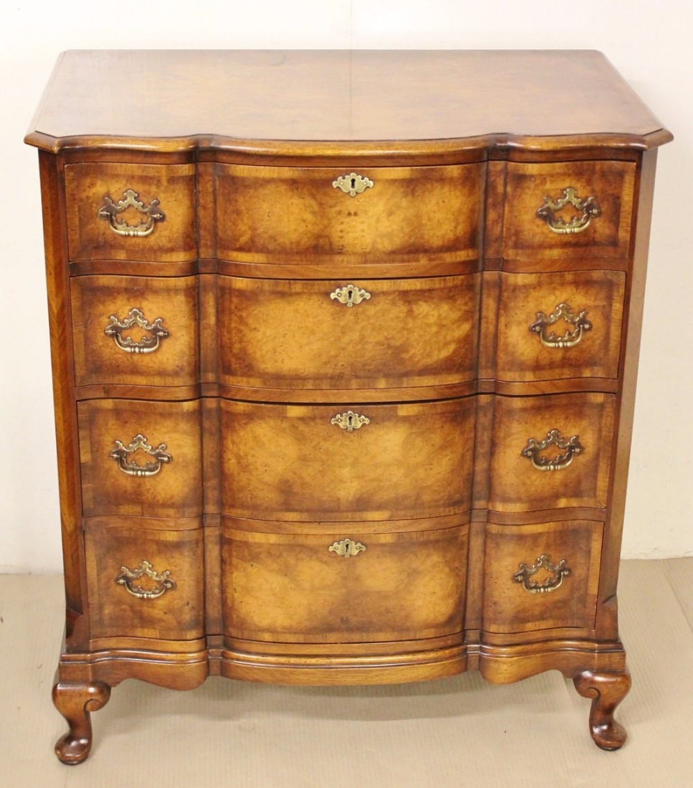 Burr Walnut Serpentine fronted Chest by Waring and Gillow