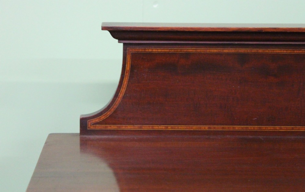 An Edwardian inlaid mahogany side cabinet featuring two outer glazed display doors, a central wooden door with an oval inlay panel, and square tapered legs. View XIII