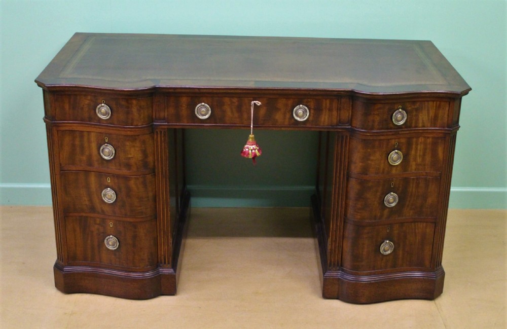 Serpentine Fronted Pedestal Desk by Waring and Gillow