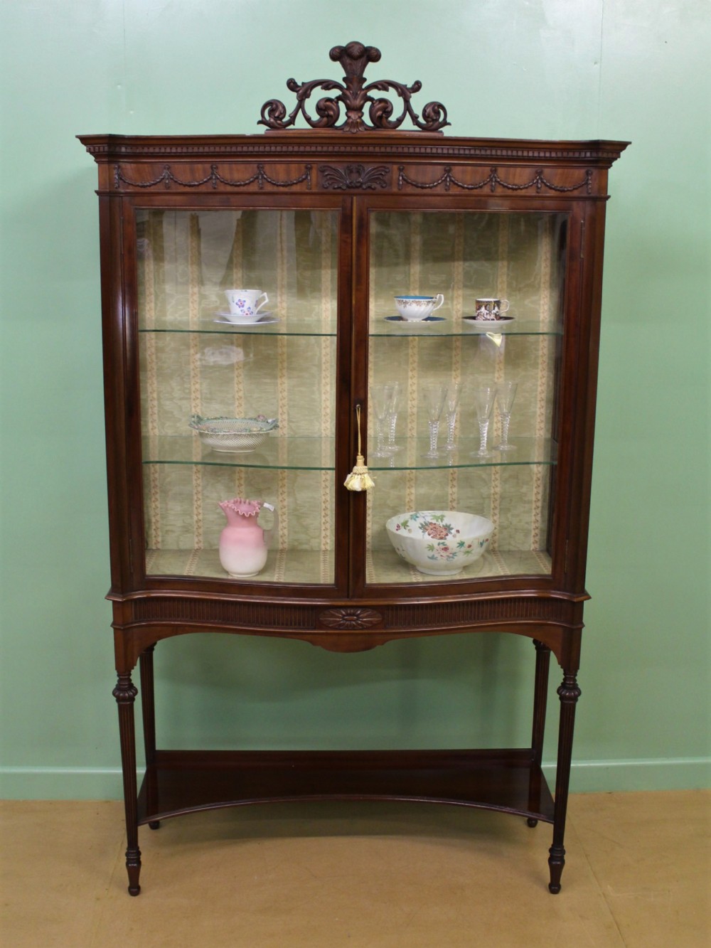 Serpentine Mahogany Display Cabinet by Maple and Co