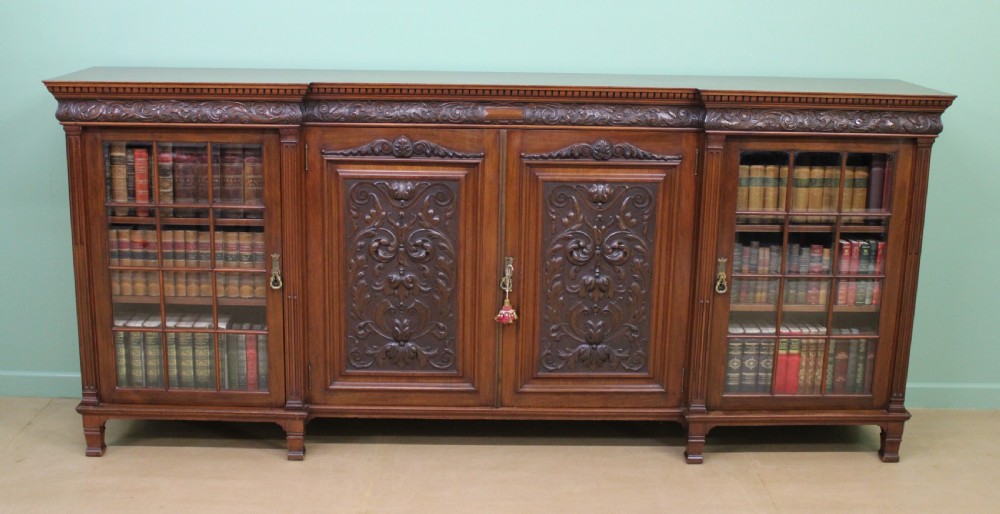 Long Victorian Carved Walnut Bookcase by Maple and Co. 