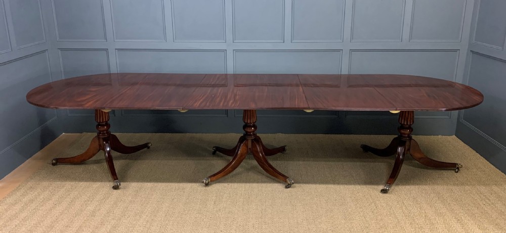 Late 19th Century Figured Mahogany Triple Pillar Dining Table