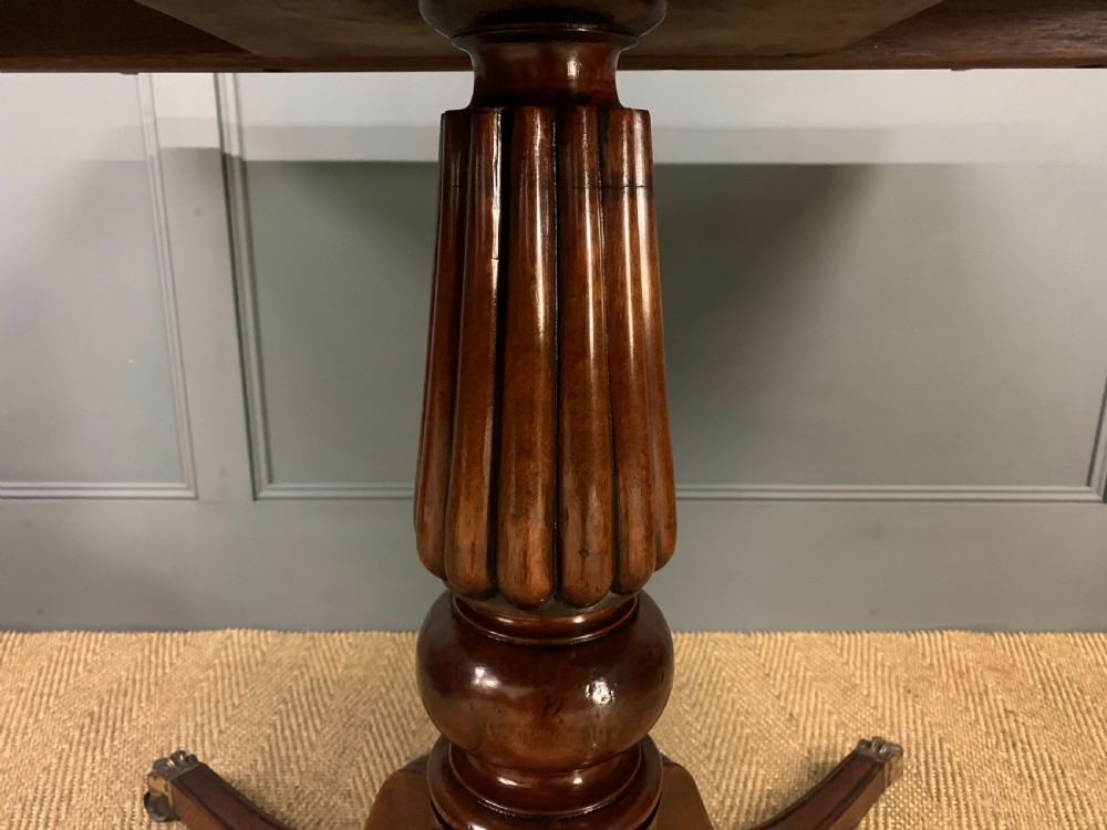 Late 19th Century Figured Mahogany Triple Pillar Dining Table View X