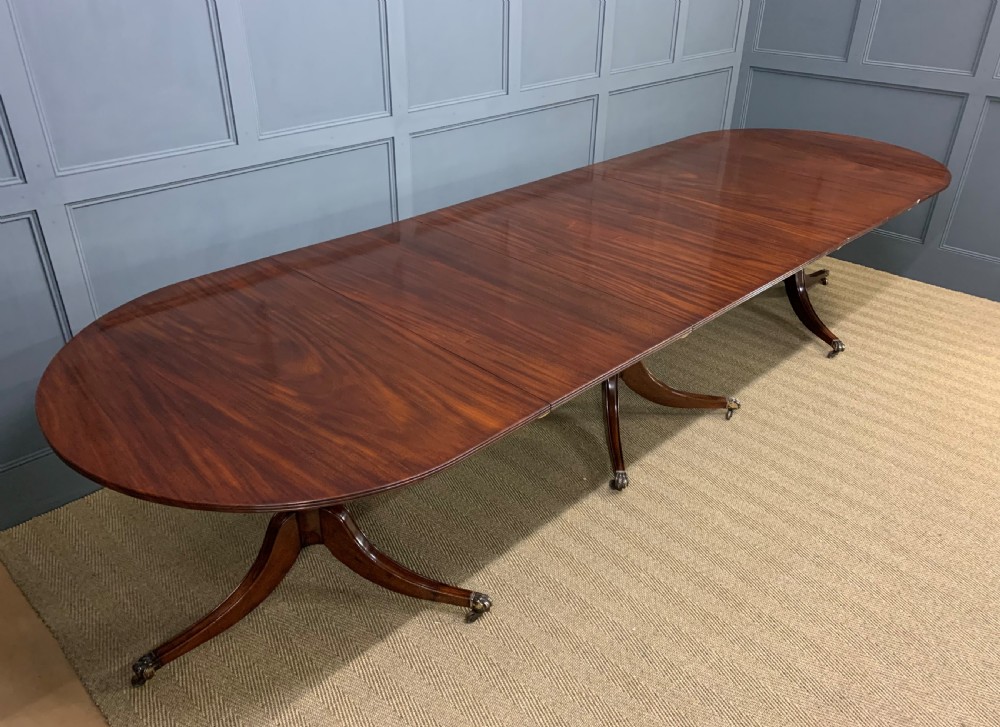 Late 19th Century Figured Mahogany Triple Pillar Dining Table View XVI