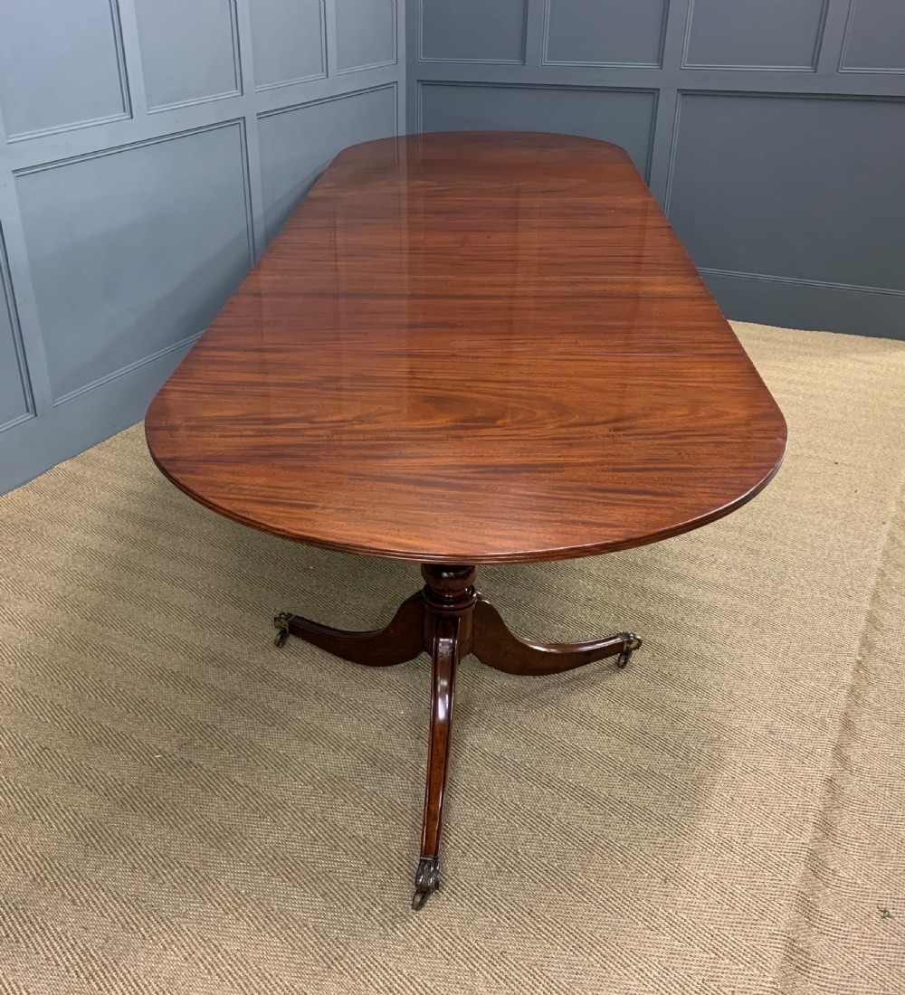 Late 19th Century Figured Mahogany Triple Pillar Dining Table View XVII