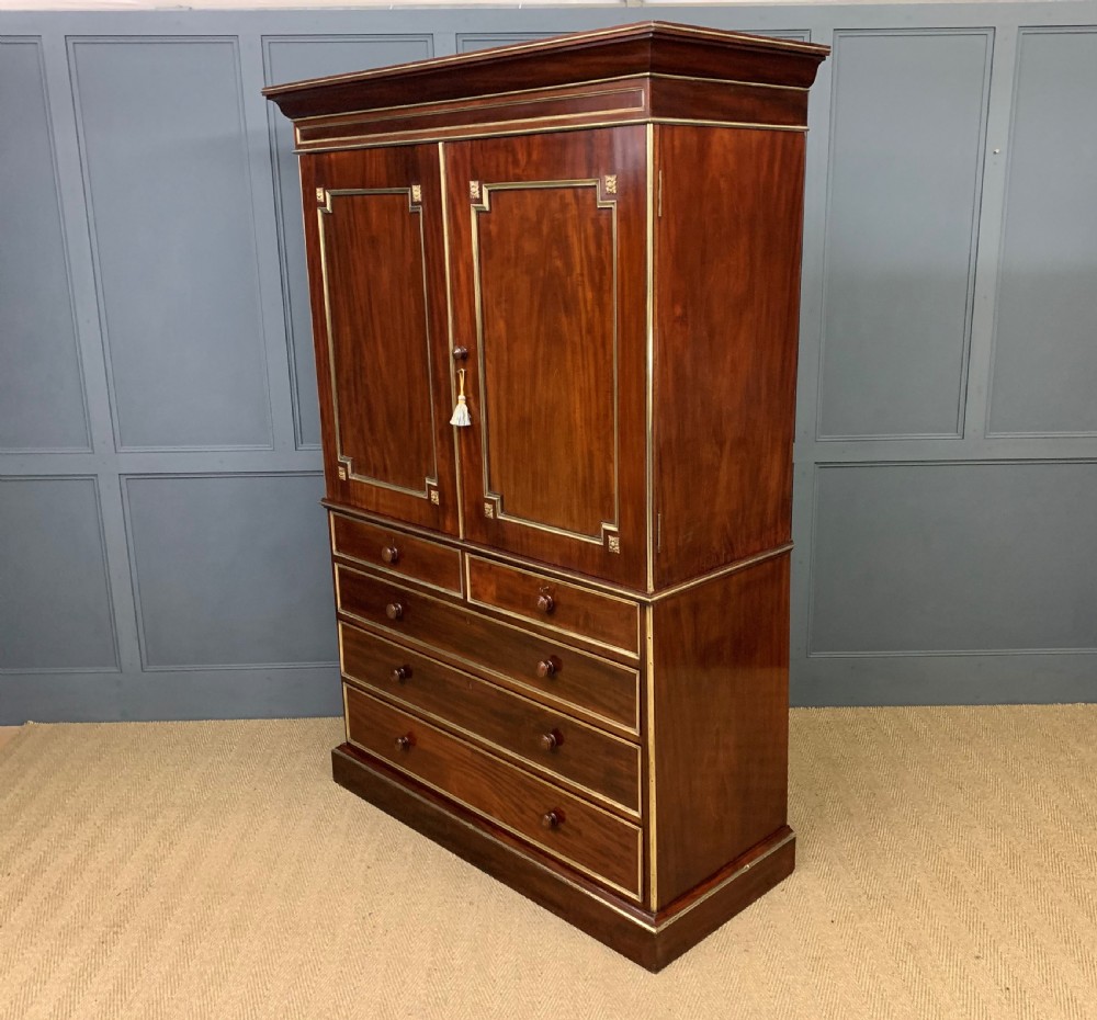 Early 19th Century Brass Mounted Flame Mahogany Linen Press View V