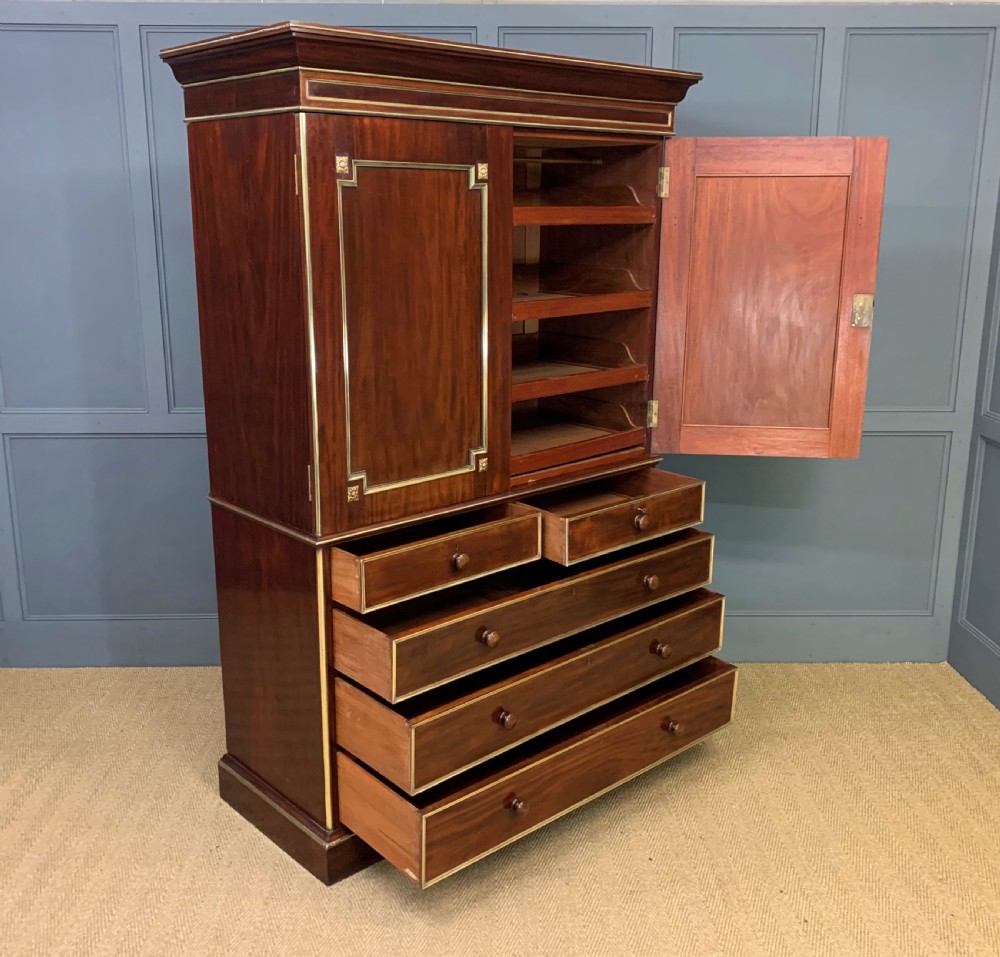 Early 19th Century Brass Mounted Flame Mahogany Linen Press View XXI