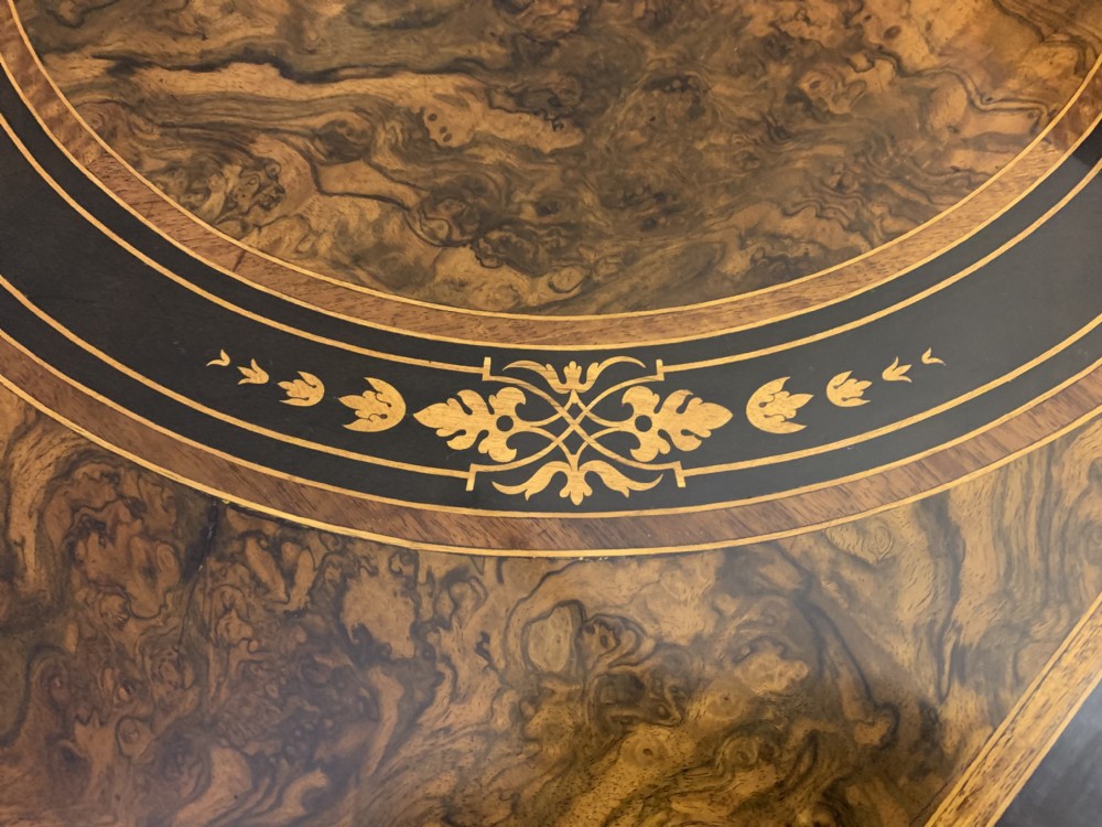 A 19th-century French burr walnut card table featuring intricate marquetry on the top, cabriole legs with gilt-bronze mounts, and a central porcelain plaque on the frieze. View XI