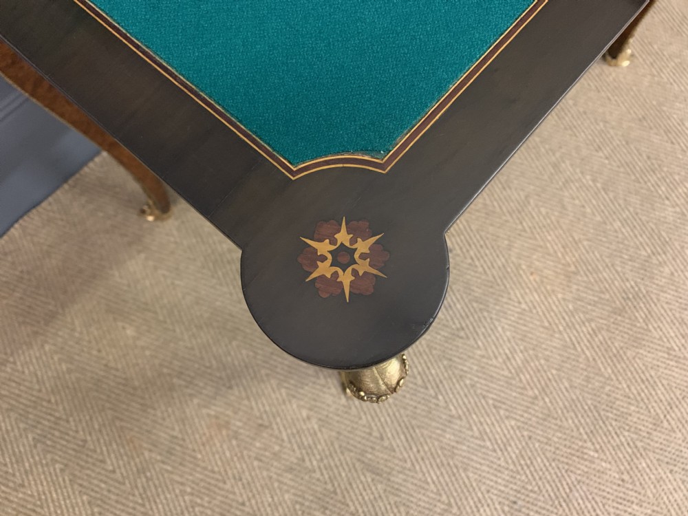 A 19th-century French burr walnut card table featuring intricate marquetry on the top, cabriole legs with gilt-bronze mounts, and a central porcelain plaque on the frieze. View XVII