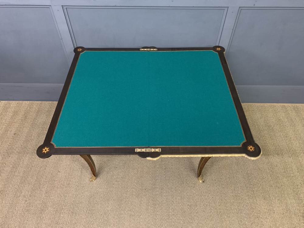 A 19th-century French burr walnut card table featuring intricate marquetry on the top, cabriole legs with gilt-bronze mounts, and a central porcelain plaque on the frieze. View XXII