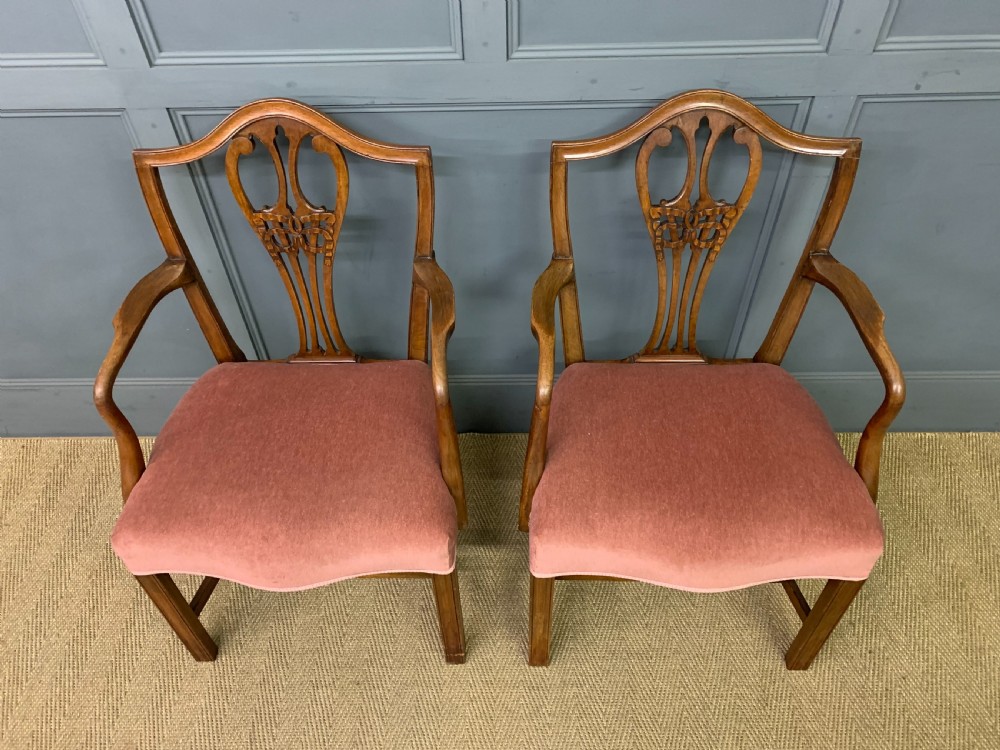 A pair of Georgian mahogany open armchairs with carved pierced splat backs and rose-coloured upholstered seats. View III