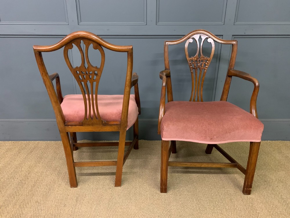 A pair of Georgian mahogany open armchairs with carved pierced splat backs and rose-coloured upholstered seats. View VI