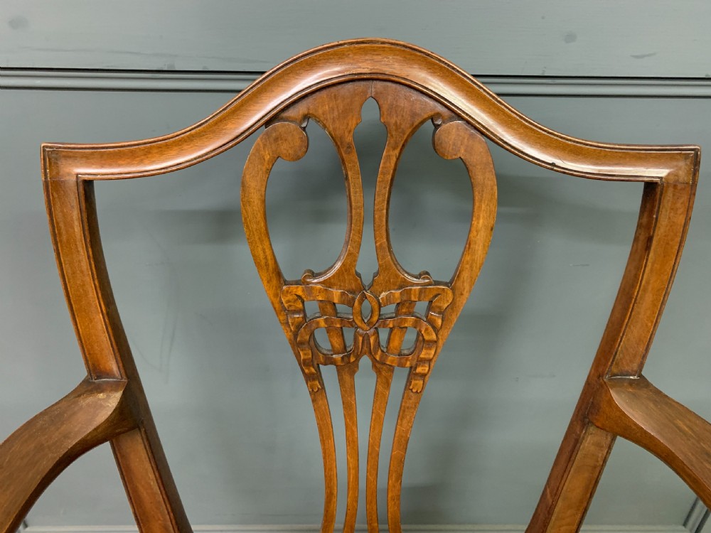 A pair of Georgian mahogany open armchairs with carved pierced splat backs and rose-coloured upholstered seats. View VII