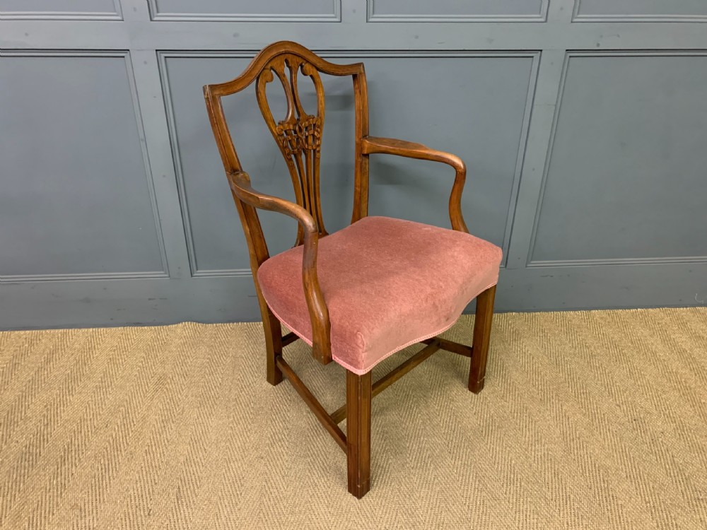 A pair of Georgian mahogany open armchairs with carved pierced splat backs and rose-coloured upholstered seats. View VIII