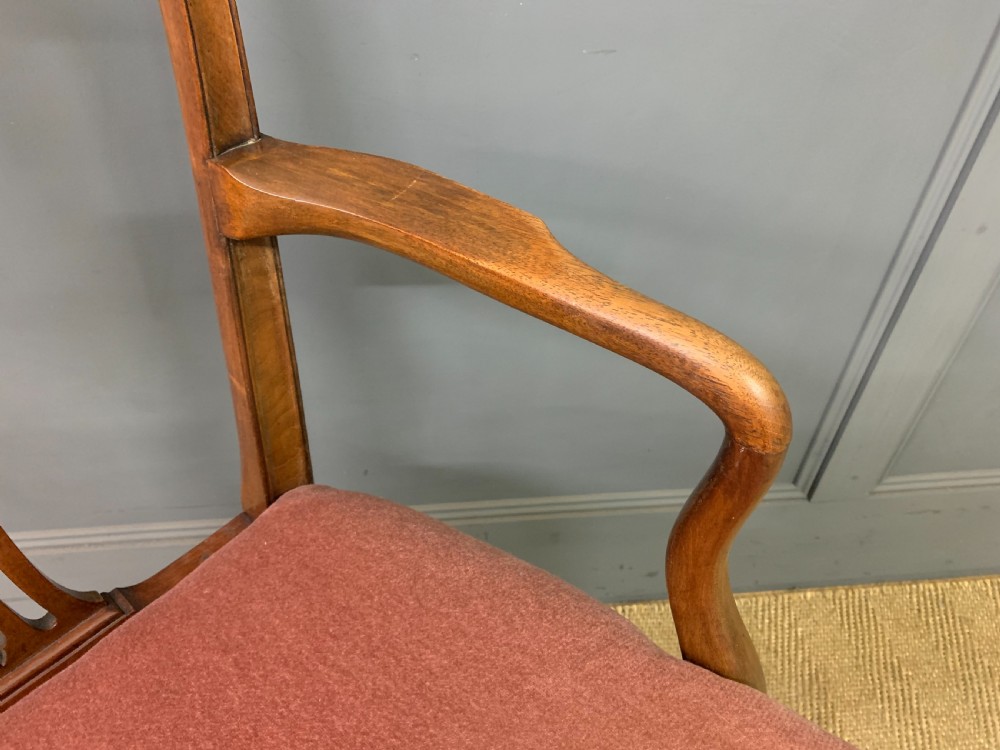 A pair of Georgian mahogany open armchairs with carved pierced splat backs and rose-coloured upholstered seats. View IX