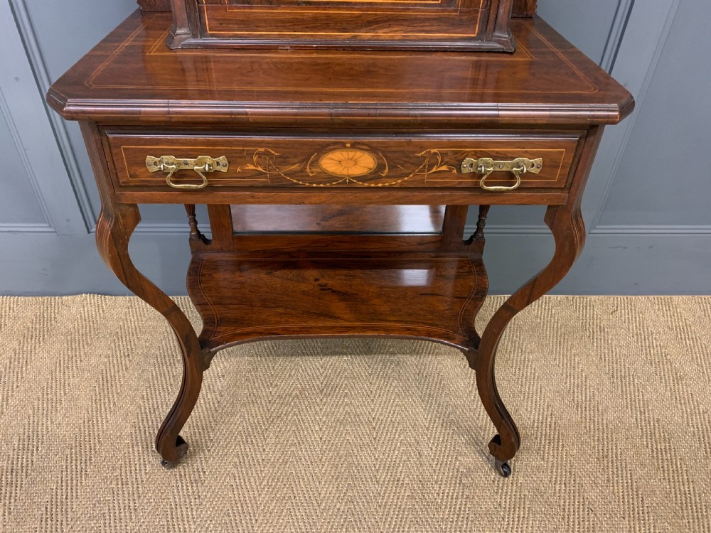 An antique inlaid rosewood bonheur du jour writing desk featuring a raised central cupboard with marquetry detail, single frieze drawer, and cabriole legs. View II