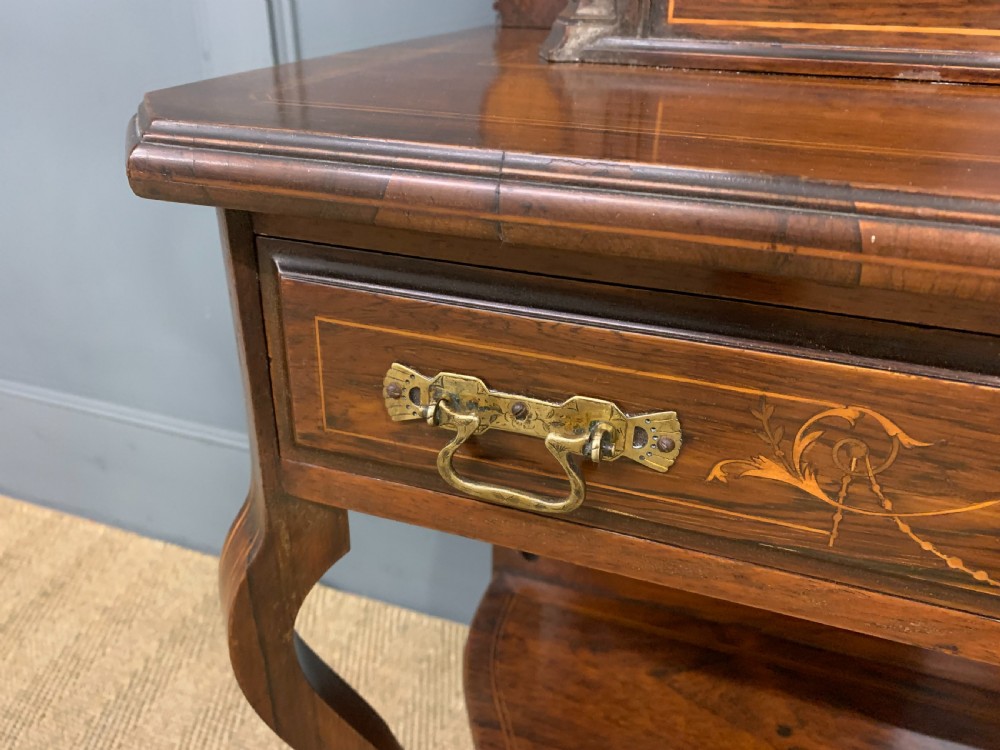 An antique inlaid rosewood bonheur du jour writing desk featuring a raised central cupboard with marquetry detail, single frieze drawer, and cabriole legs. View V