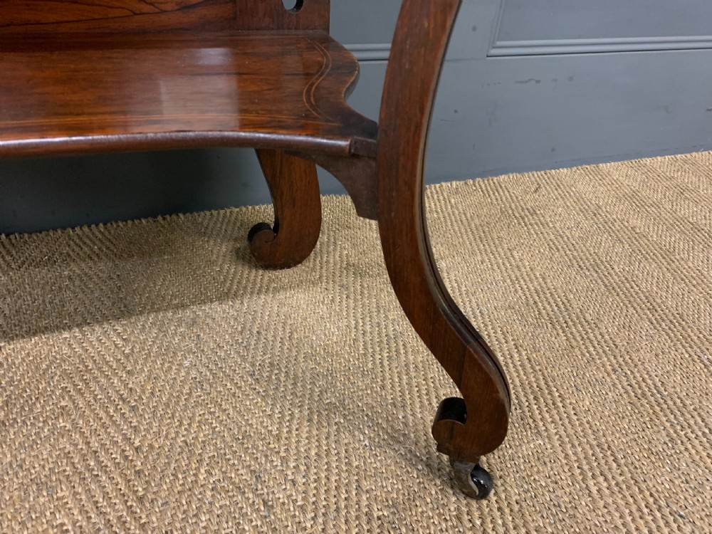 An antique inlaid rosewood bonheur du jour writing desk featuring a raised central cupboard with marquetry detail, single frieze drawer, and cabriole legs. View X