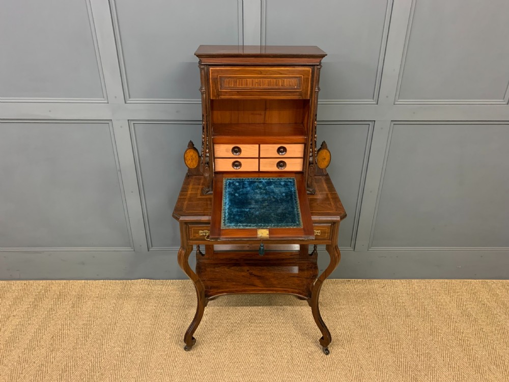An antique inlaid rosewood bonheur du jour writing desk featuring a raised central cupboard with marquetry detail, single frieze drawer, and cabriole legs. View XI