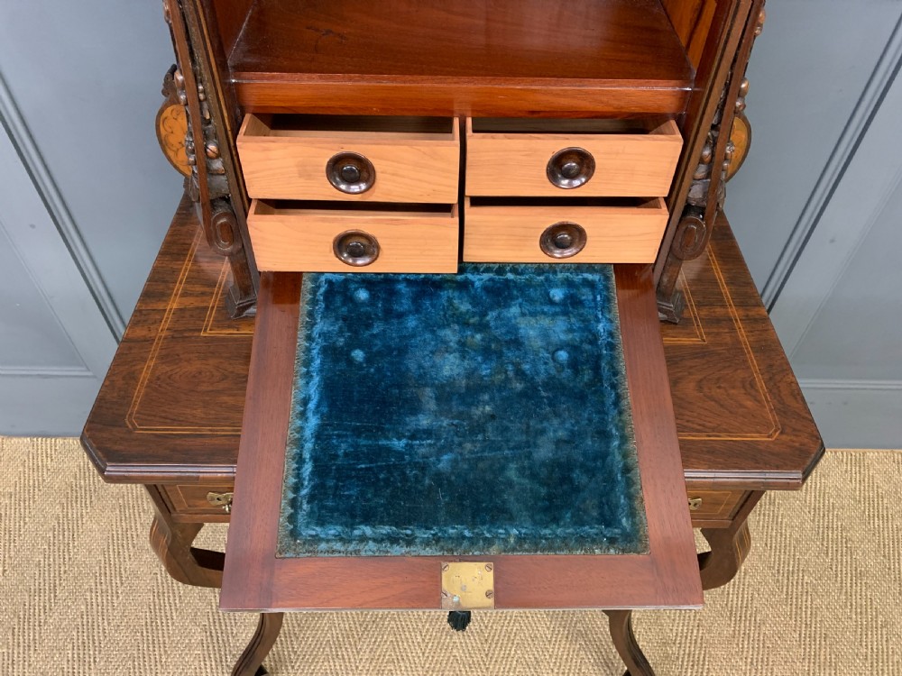 An antique inlaid rosewood bonheur du jour writing desk featuring a raised central cupboard with marquetry detail, single frieze drawer, and cabriole legs. View XII