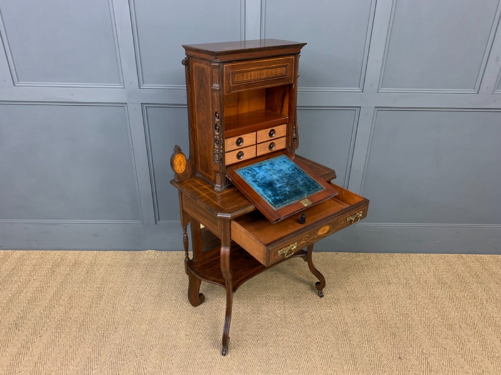 An antique inlaid rosewood bonheur du jour writing desk featuring a raised central cupboard with marquetry detail, single frieze drawer, and cabriole legs. View XIV
