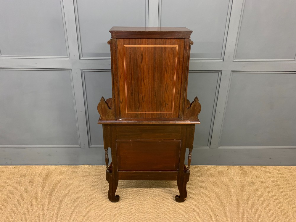An antique inlaid rosewood bonheur du jour writing desk featuring a raised central cupboard with marquetry detail, single frieze drawer, and cabriole legs. View XVIII