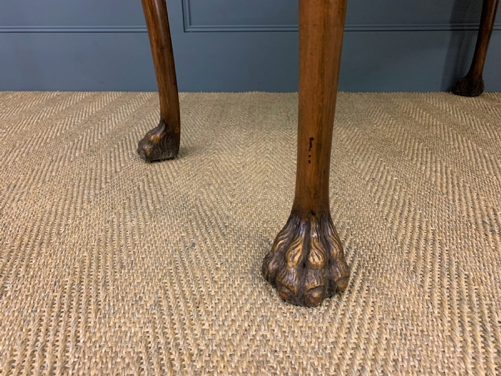A burr walnut side table featuring two drawers with feather banding, carved egg-and-dart moulding, gilded accents, cabriole legs, and ball-and-claw feet. View XII