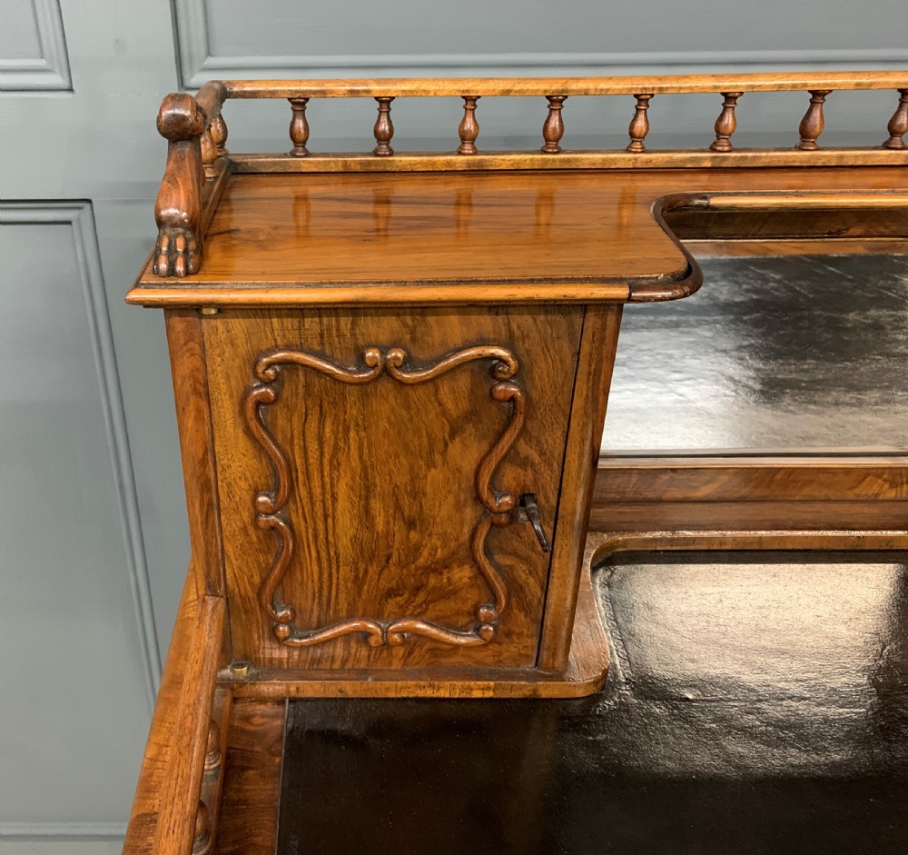 A 19th-century burr walnut bonheur du jour writing desk with a dark leather top, slender cabriole legs, and a gallery section featuring mirrors and small side cabinets. View IX