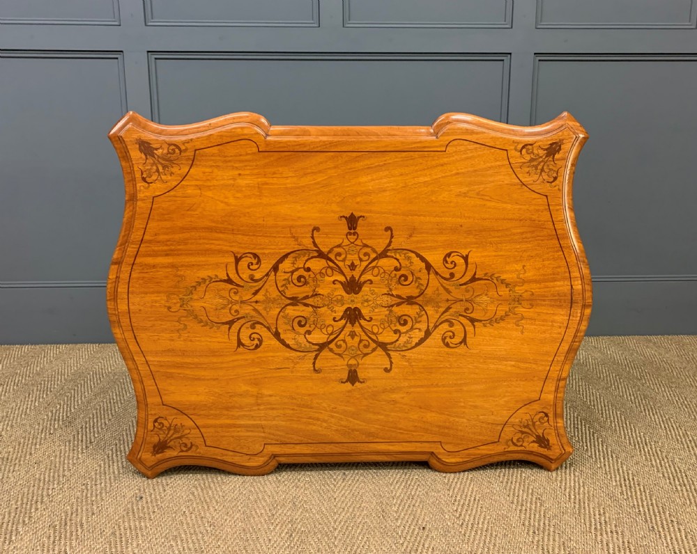 A 19th-century satinwood side table featuring floral marquetry inlay, serpentine edges, curved cabriole legs, and brass corner mounts. View XIV