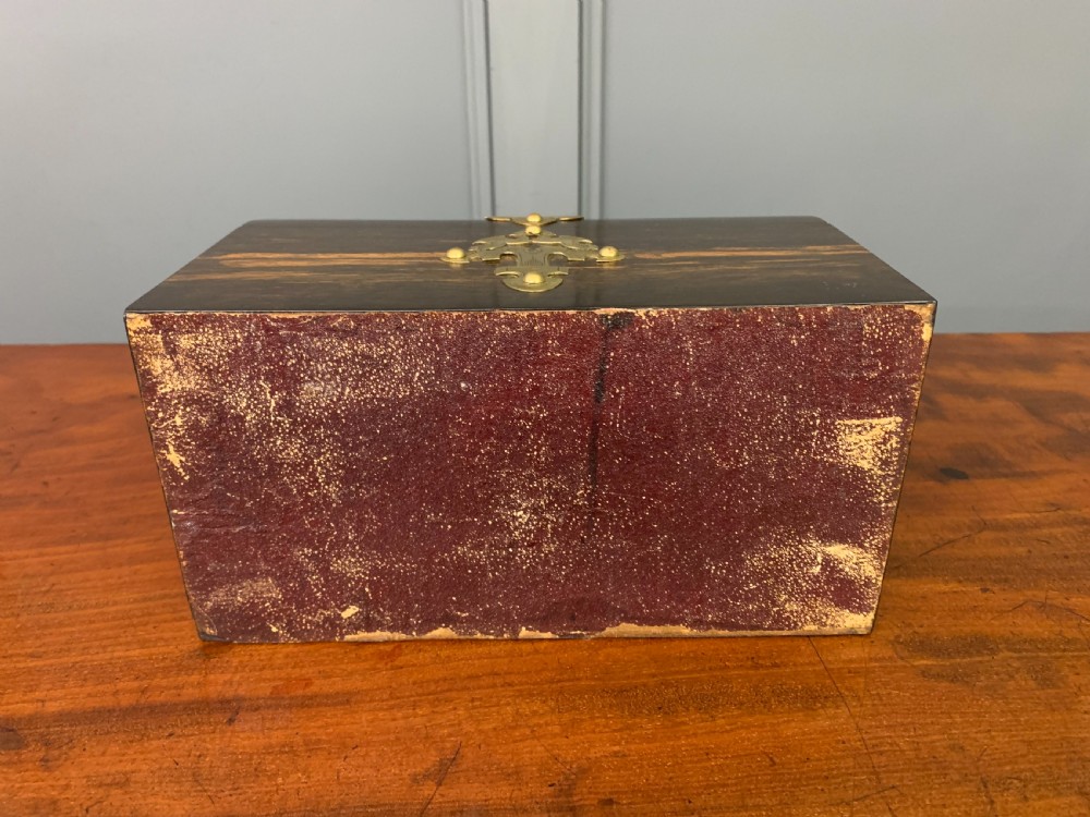 A Victorian dome-topped stationery casket crafted from dark variegated coromandel wood, decorated with pierced brass strapwork and a blue and white ceramic cameo inset. View XIV