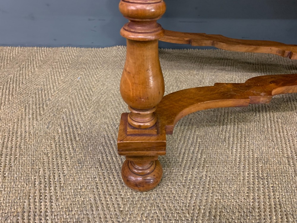 A rectangular walnut side table featuring three drawers with brass teardrop drop-handles, spiral barley twist legs, and a serpentine X-stretcher with a central turned finial. View VIII