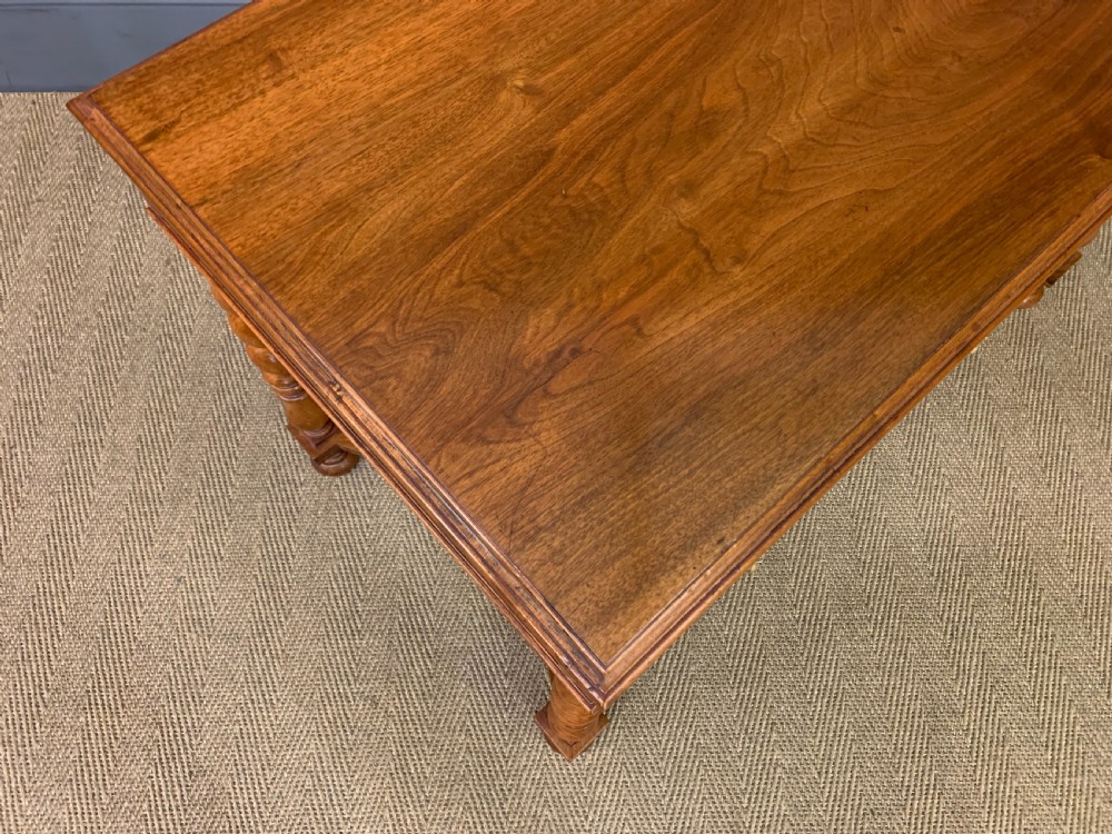 A rectangular walnut side table featuring three drawers with brass teardrop drop-handles, spiral barley twist legs, and a serpentine X-stretcher with a central turned finial. View XII
