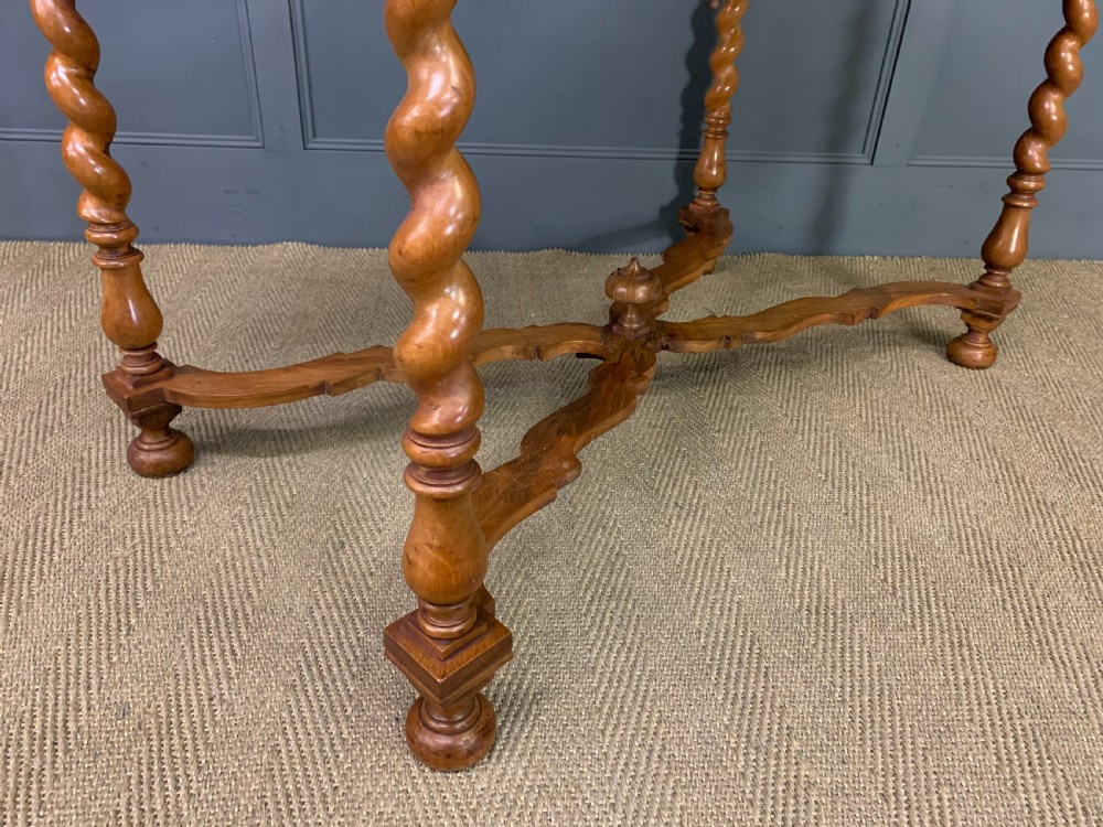 A rectangular walnut side table featuring three drawers with brass teardrop drop-handles, spiral barley twist legs, and a serpentine X-stretcher with a central turned finial. View XIV