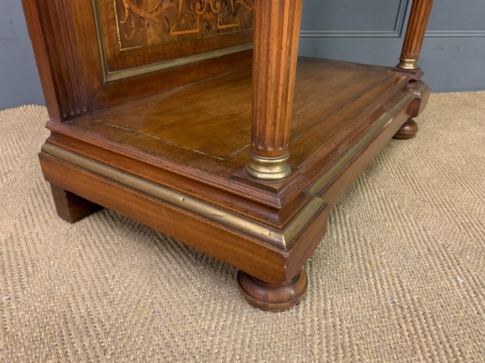 A 19th-century walnut pier table featuring a white marble top, inlaid floral and urn marquetry, fluted front columns with gilt mounts, and a lower open shelf. View XVI
