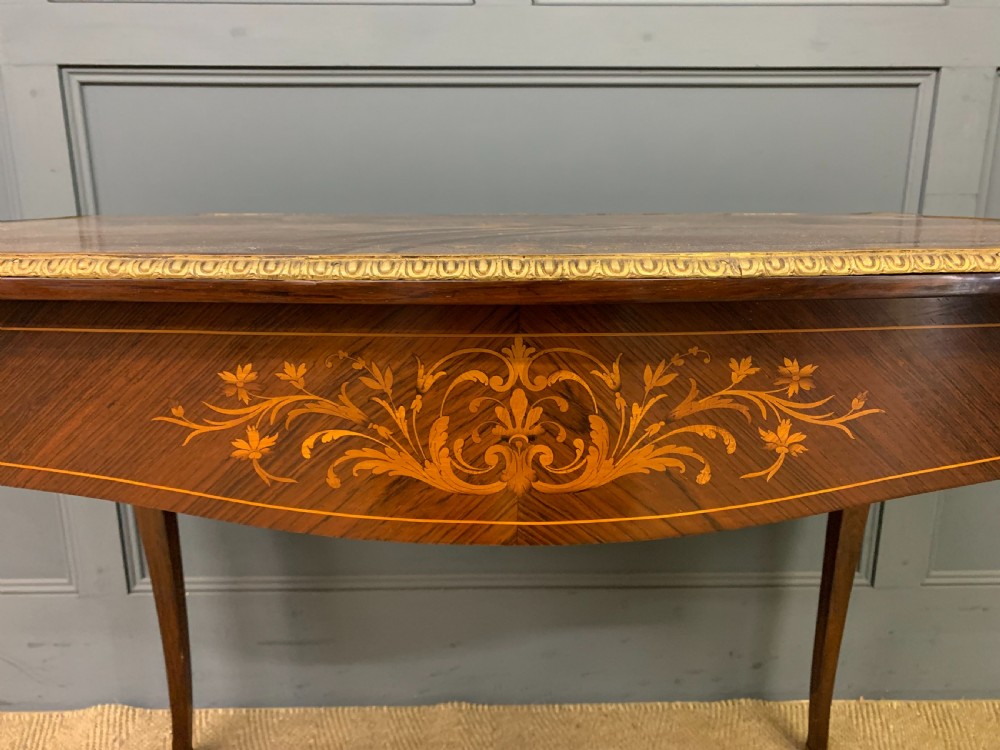 An antique rosewood occasional table featuring floral marquetry inlays across the serpentine top and apron, supported by cabriole legs with gilt-bronze ormolu mounts. View IV