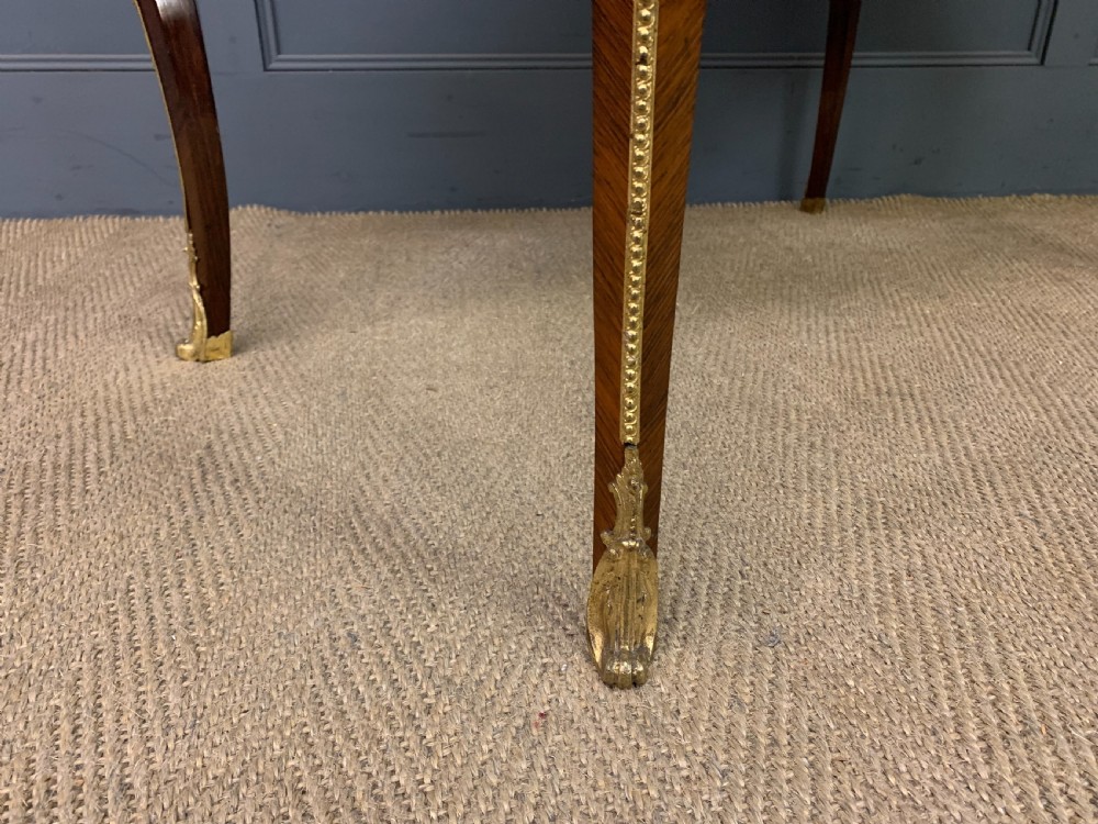 An antique rosewood occasional table featuring floral marquetry inlays across the serpentine top and apron, supported by cabriole legs with gilt-bronze ormolu mounts. View VIII