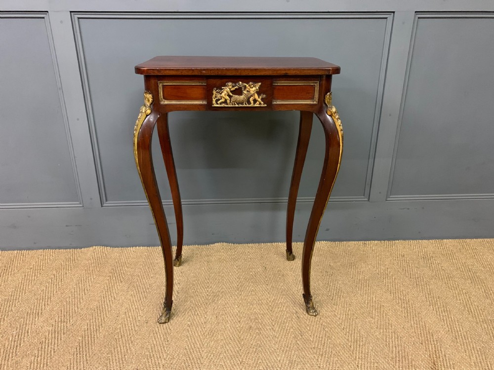 A rectangular dark mahogany side table featuring slender cabriole legs, gilt bronze corner mounts, and a decorative ormolu relief plaque on the frieze. View III