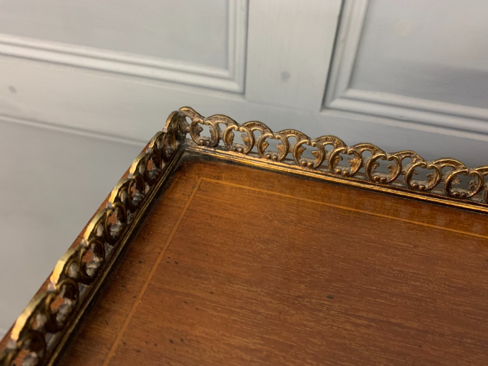 An Edwardian inlaid mahogany bonheur du jour writing desk featuring a central arched mirror, twin side cabinets with oval marquetry, brass galleries, and a lower shelf over tapered legs. View XIV