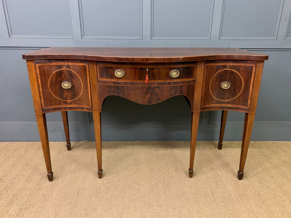 Georgian Inlaid Mahogany Serpentine Sideboard View II
