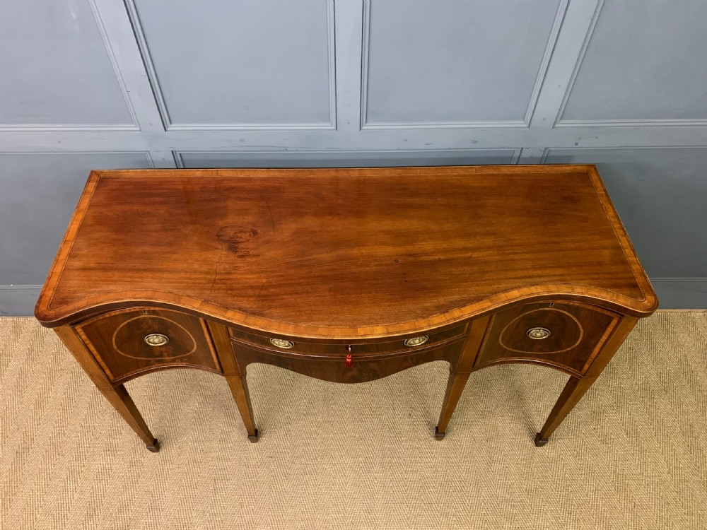 Georgian Inlaid Mahogany Serpentine Sideboard View III