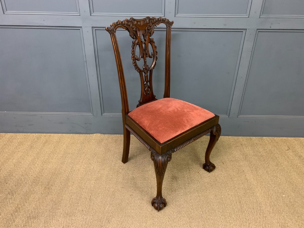 A pair of Chippendale style mahogany side chairs featuring intricate pierced back splats, cabriole legs with ball and claw feet, and terracotta velvet upholstered seats. View XI
