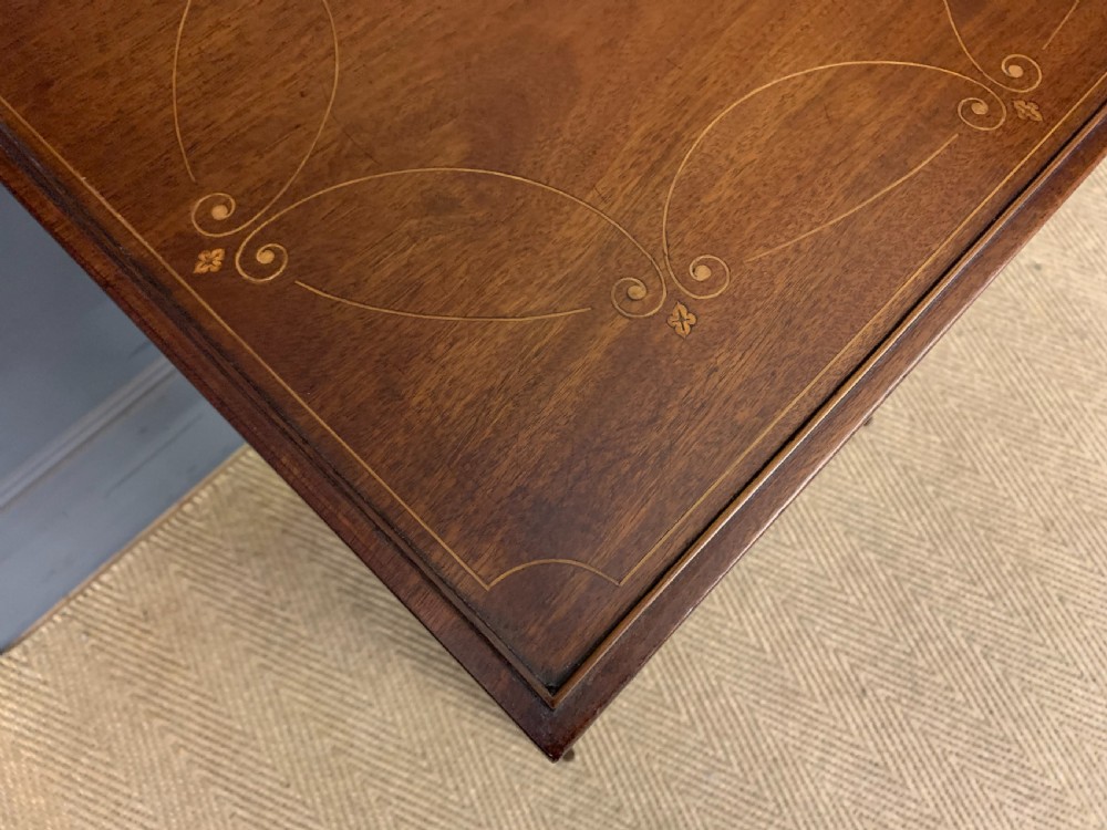 A set of four graduating mahogany nest of tables featuring satinwood line inlay and slender turned legs. View V