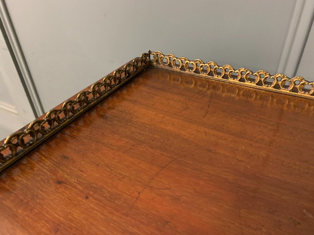 A freestanding mahogany vitrine featuring floral marquetry, a single glazed door, a brass top gallery, and cabriole legs with metal mounts. View V