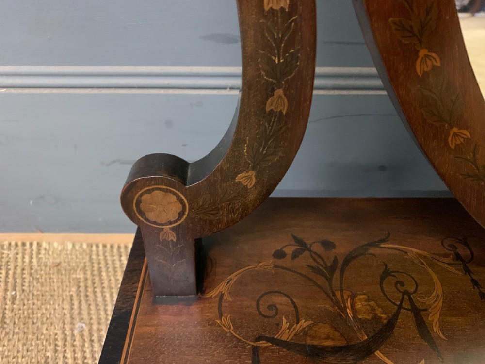 A Georgian mahogany toilet mirror featuring a shield-shaped swing frame, inlaid satinwood urn motifs, and a drawer base with curved fronting. View V