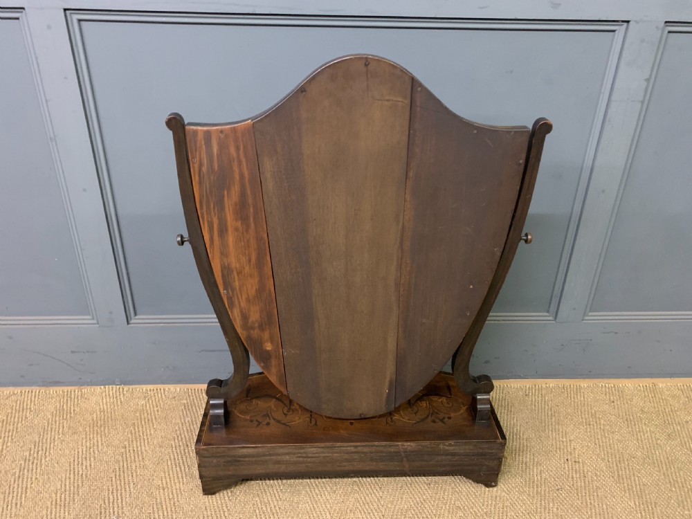 A Georgian mahogany toilet mirror featuring a shield-shaped swing frame, inlaid satinwood urn motifs, and a drawer base with curved fronting. View XIII